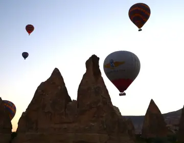 Sunrise view of fairy chimneys and balloons Cappadocia