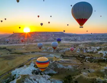 Aerial landscape of sunrise Cappadocia balloons
