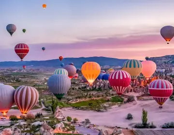 Sunrise glow launch of Cappadocia balloons