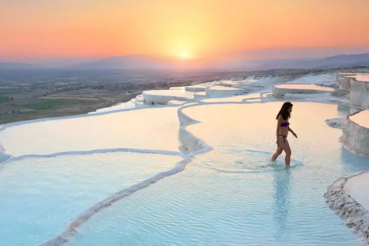 Sunset beauty of reflective blue pools in Pamukkale