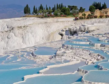 Wide blue landscape of Pamukkale travertine terraces
