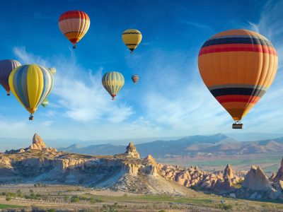 Bright blue sky with Cappadocia hot air balloons