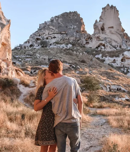 Couple hiking in fairy chimneys landscape