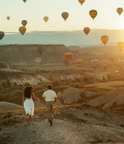 Family walking in valley with balloon view