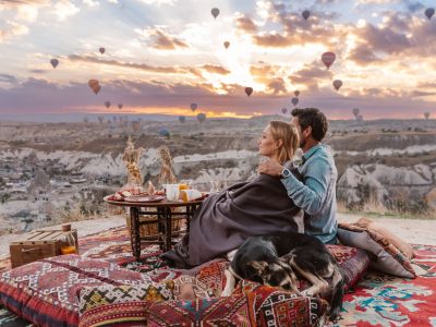 Romantic couple dinner at sunset with balloons view