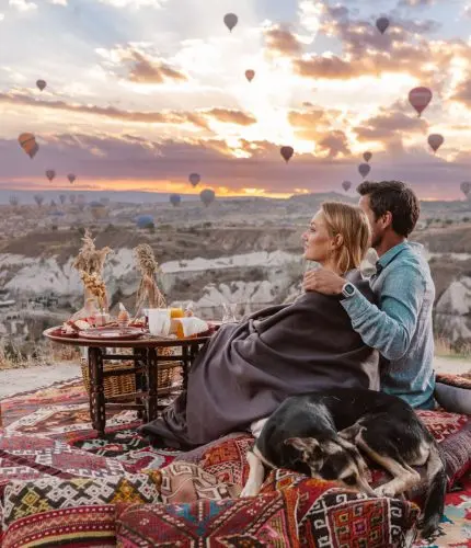 Romantic couple dinner at sunset with balloons view