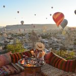 Traditional terrace breakfast at sunrise with balloons