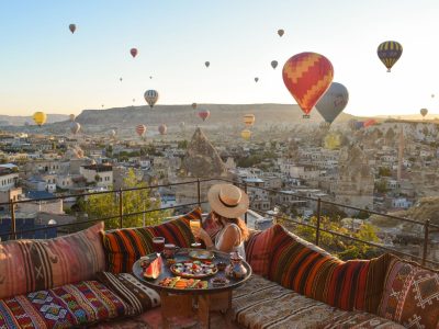 Traditional terrace breakfast at sunrise with balloons
