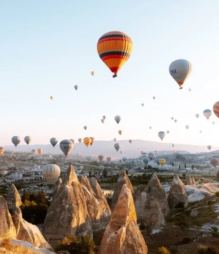 Colorful balloons floating on Cappadocia horizon