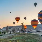 Colorful hot air balloons floating over Cappadocia
