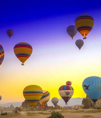 Colorful sunrise sky with Cappadocia balloons