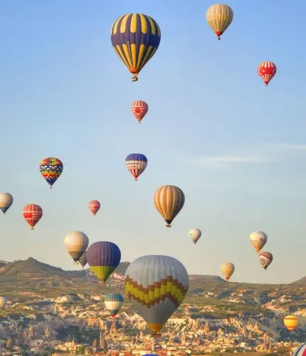 Dawn balloon scene over Cappadocia ridge