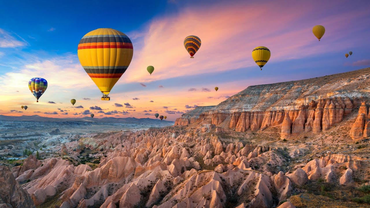 Hillside view of hot air balloons in Cappadocia