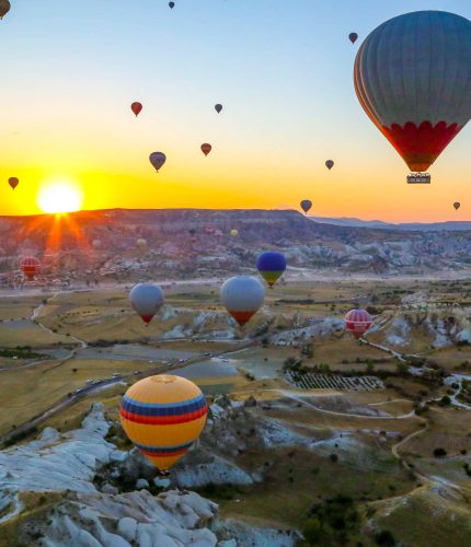 Aerial landscape of sunrise Cappadocia balloons
