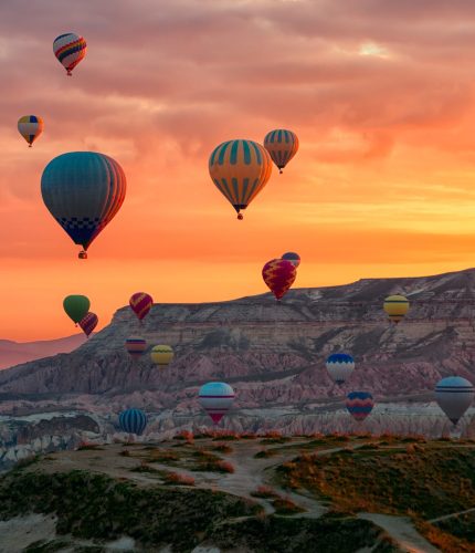 Sunrise hot air balloons over Goreme valley