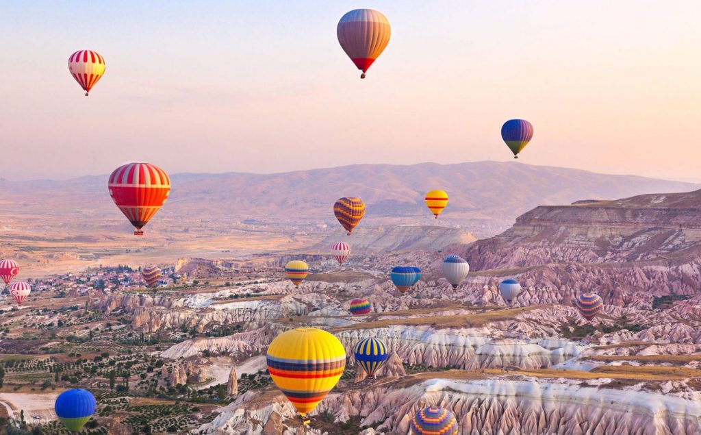 Twilight sky filled with hot air balloons in Cappadocia
