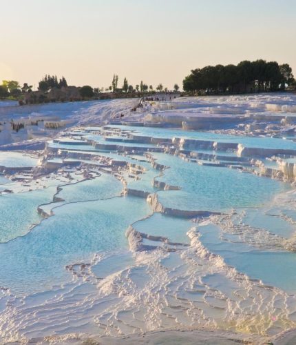 Aerial view of pink sunset reflection on Pamukkale terraces