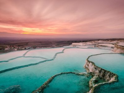Aerial view of turquoise lake and mountains in Pamukkale